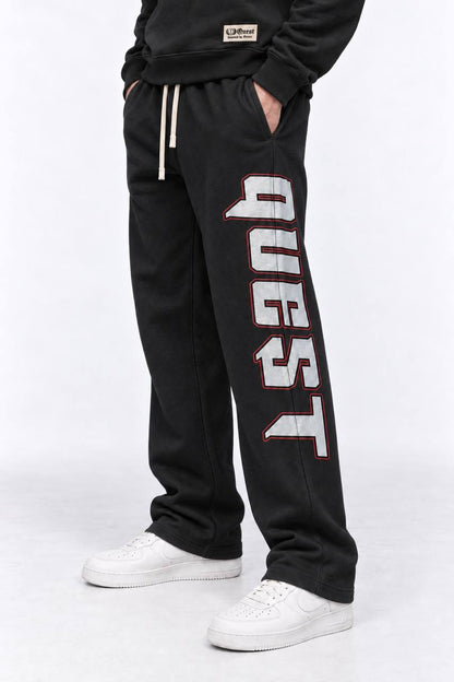 Black relaxed sweatpants with grey and red QUEST leg print