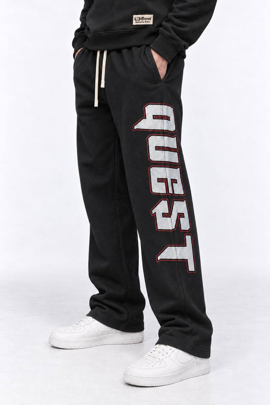 Black relaxed sweatpants with grey and red QUEST leg print