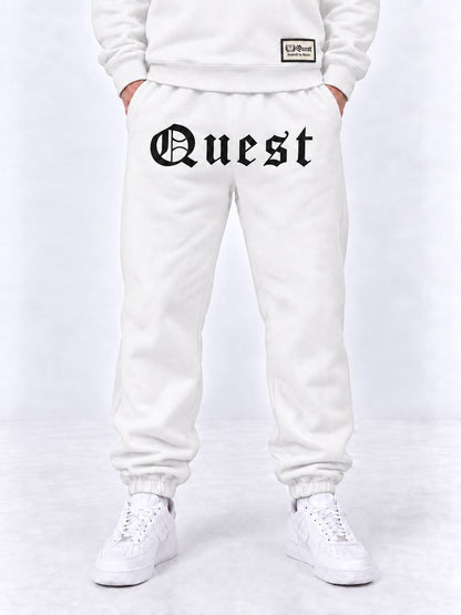 Black cuffed joggers with white blackletter Quest thigh print