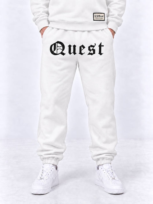 Black cuffed joggers with white blackletter Quest thigh print