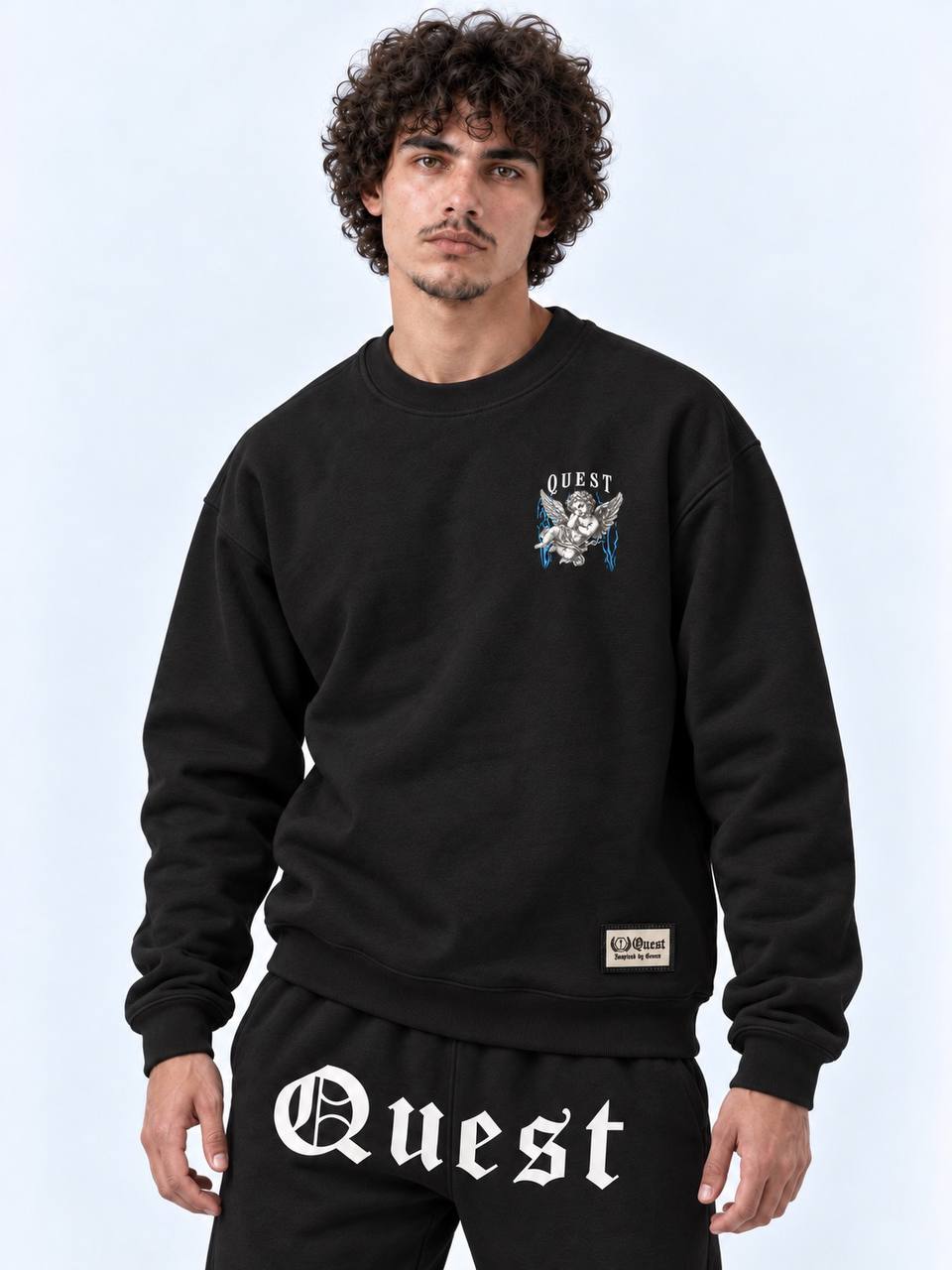Black oversized sweatshirt with small engraved cherub chest print